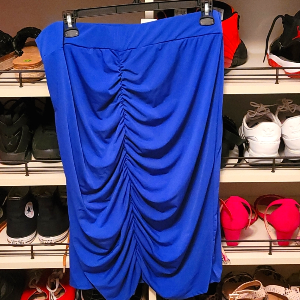 Brand new blue stretchy straight line skirt that is ruched in the back.